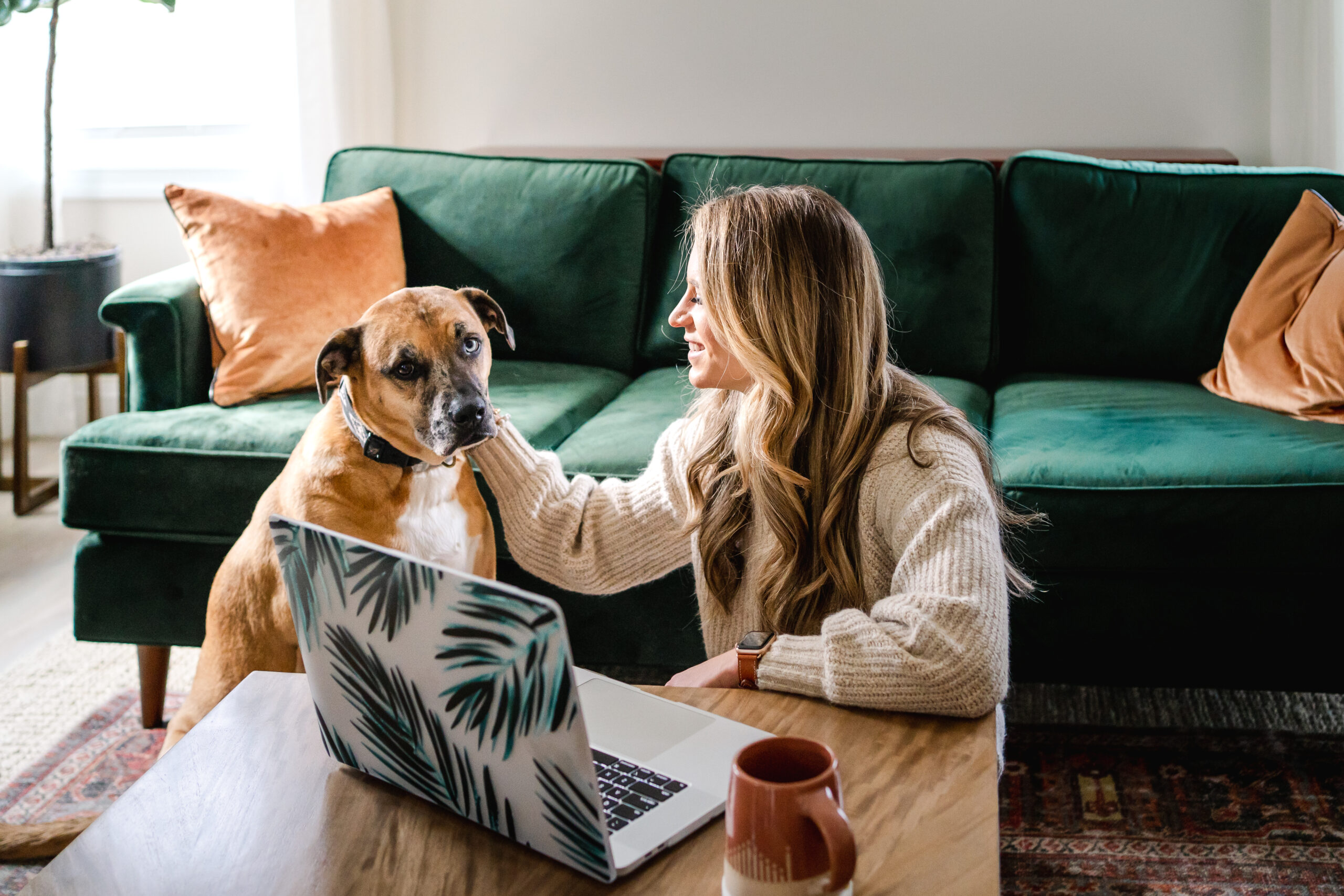 Photo of Laura with pet dog used for blog about how to make sales feel natural for health entrepreneurs